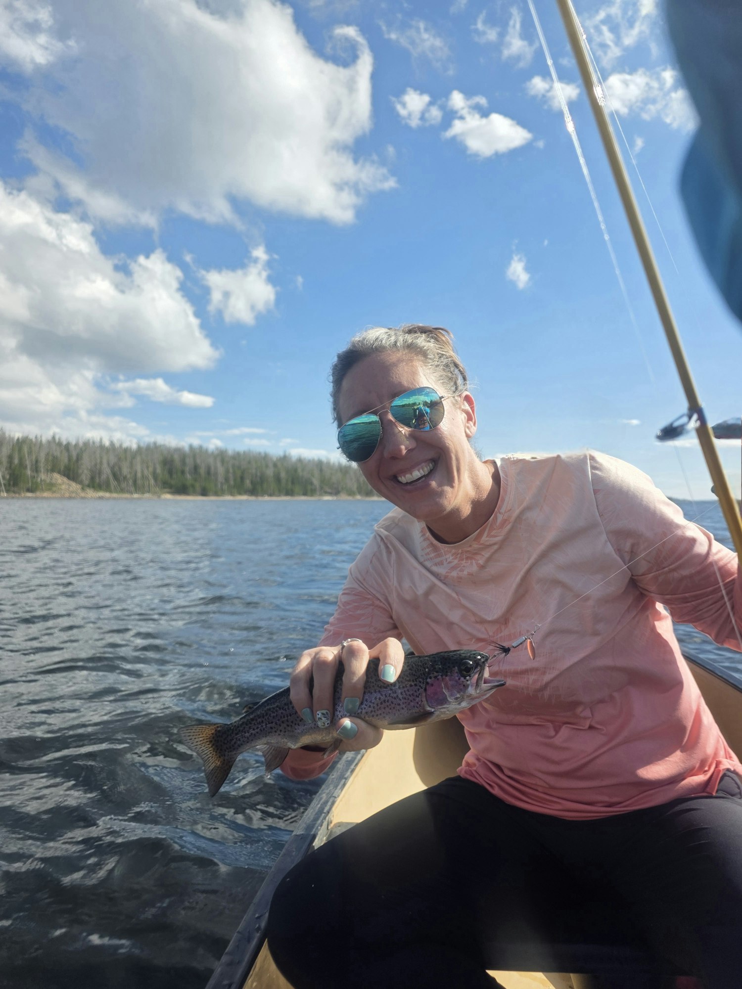 May contain: face, head, person, photography, portrait, accessories, sunglasses, animal, fish, sea life, fishing, leisure activities, outdoors, water, adult, male, man, happy, smile, and trout